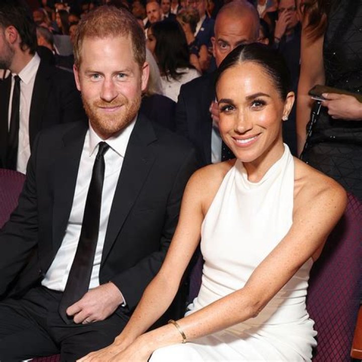 Who did meghan markle grew up with?